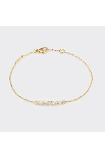 Le bracelet Sarah, en or jaune 750‰, serti de diamants taille marquise et brillant.