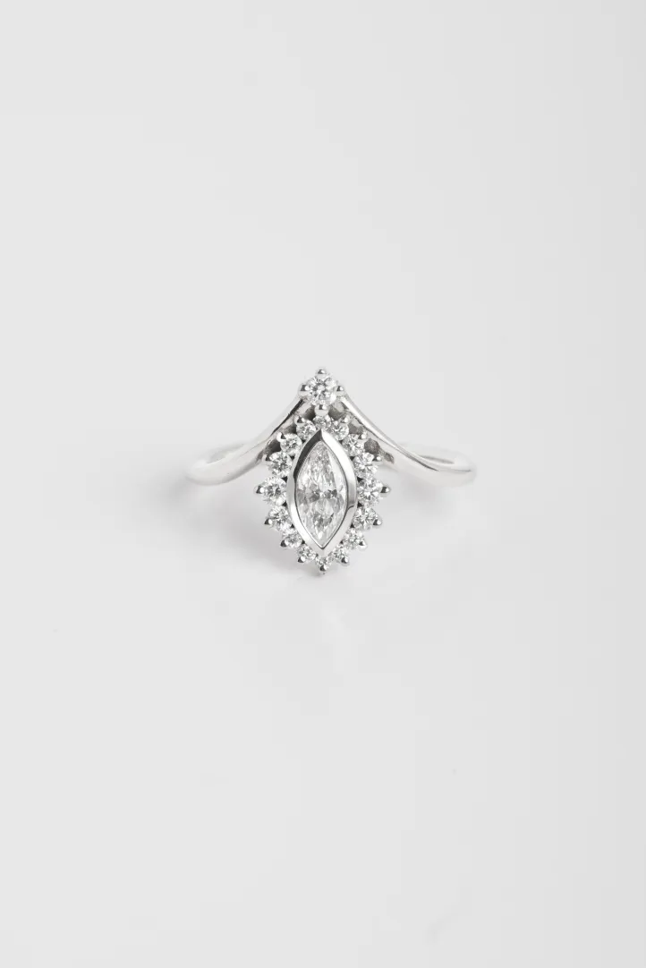 The Castille ring, in 18k white gold set with a marquise diamond and accompanied by brilliant-cut diamonds. The Castille ring, in 18k white gold set with a marquise diamond and accompanied by brilliant-cut diamonds.