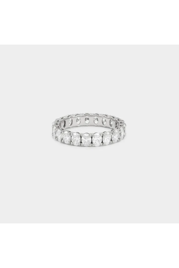 The Classic ring, in 18k gold, full band set with oval diamonds. The Classic ring, in 18k gold, full band set with oval diamonds.