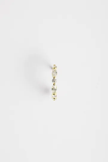 The Elodie hoop earring in 18k yellow gold, set with marquise and brilliant-cut diamonds, with a secure clasp.