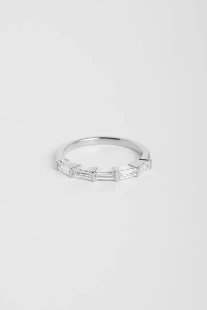 The Florence ring in 18k white gold set with baguette-cut diamonds. The Florence ring in 18k white gold set with baguette-cut diamonds.