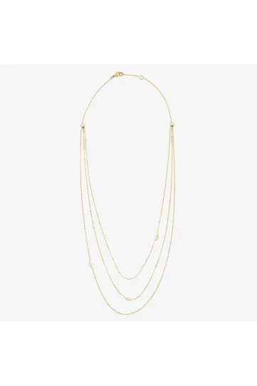 Un collier 3 rangs en or jaune 750‰ serti de trois diamants taille marquise.