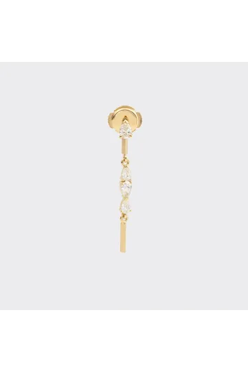 An Ibtissame earring, composed of a gold stud set with a pear-cut diamond with a secure clasp, and a mobile module set with a gradient of pear-cut diamonds.