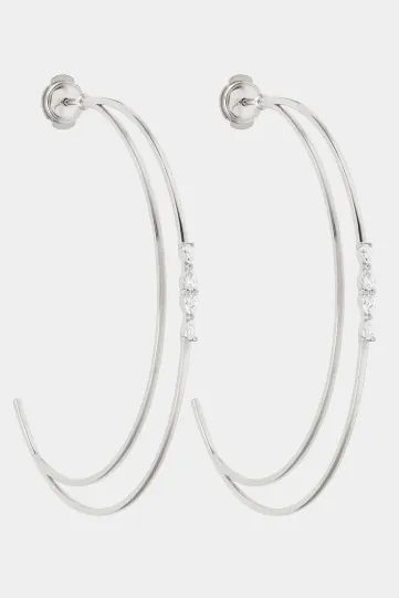 The Elodie hoop earring in 18k yellow gold, set with marquise and brilliant-cut diamonds, with a secure clasp.