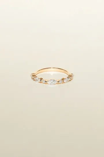 <p>The Emmanuelle ring, in 18k rose gold, set with a marquise diamond and accompanied by marquise and brilliant-cut diamonds.</p>