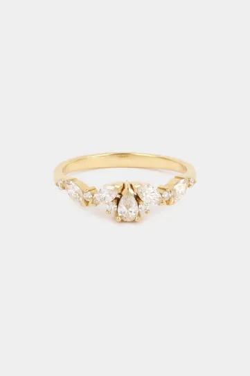 <p>The Rania Poire ring in 18k rose gold set with a pear-cut diamond and accompanied by marquise-cut and brillant-cut diamonds.</p>